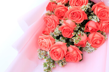 Bouquet of pink rose flowers with white flowers decorated on pink, Bouquet flowers for Valentines and special days