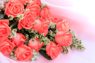 Bouquet of pink rose flowers with white flowers decorated on pink, Bouquet flowers for Valentines and special days