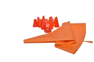 Various shapes of nozzles for a pastry syringe and a fabric syringe lie on a white background.