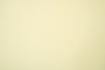 Creamy yellow background image with a rough texture.
