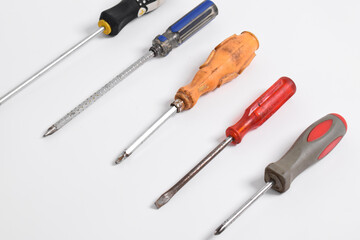Collection of old screwdrivers isolated on white background