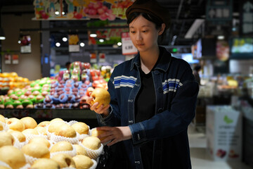 Shopper Picking Fresh Pears at Grocery Store Section