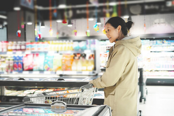 Woman Shopping for Frozen Goods at Supermarket