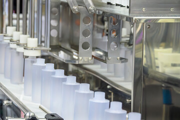  The  empty healthcare  bottles  on the conveyor belt for filling process. T