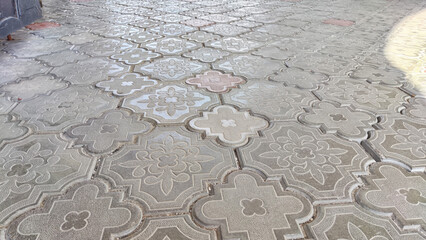 Paving slabs. Background, texture. Patterned Paving Slabs in Sunlight