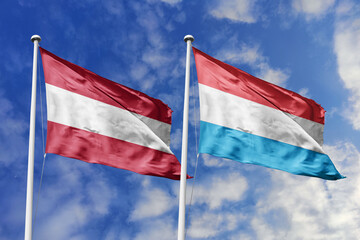 3d illustration. Austria and Luxembourg Flag waving in sky. High detailed waving flag. 3D render. Waving in sky. Flags fluttered in the cloudy sky.