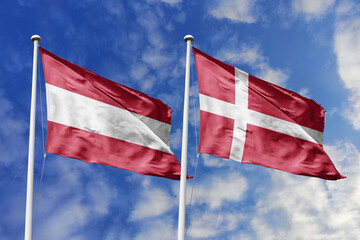 3d illustration. Austria and Denmark Flag waving in sky. High detailed waving flag. 3D render. Waving in sky. Flags fluttered in the cloudy sky.
