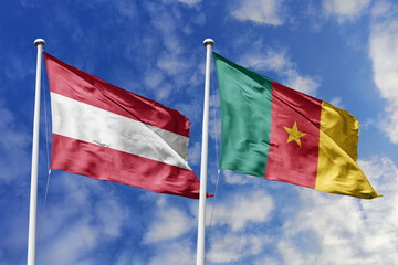 3d illustration. Austria and Cameroon Flag waving in sky. High detailed waving flag. 3D render. Waving in sky. Flags fluttered in the cloudy sky.