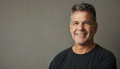 Fototapeta premium Confident Man in Black Shirt with a Warm Smile