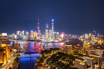 Shanghai Skyline Illuminated at Night with Vibrant Lights