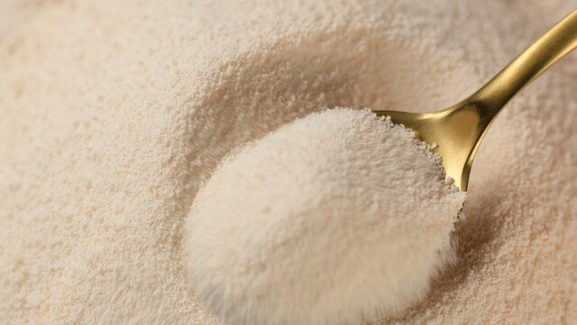 Collagen powder dietary supplement. Taking spoon with collagen