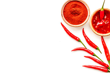 Cooking hot food with chilli pepper on white table background top view copy space