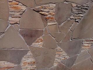 Stone wall texture. stones of different colors make up the texture and background of the mountain stone.