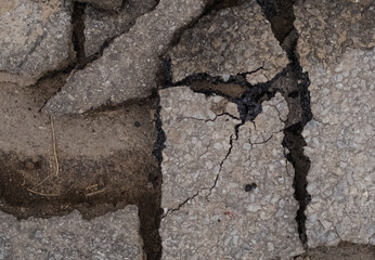 Selective focus background image of broken asphalt,  road work theme
