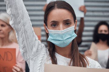 Outdoor, woman and protest with mask, cardboard and fight for right of choice, covid19 and vaccine....