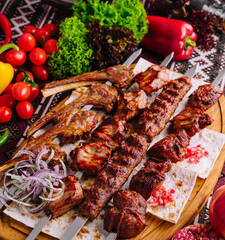 Traditional grilled shashlik skewers on wooden board
