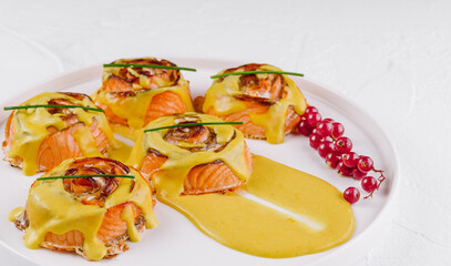 Gourmet salmon appetizers with hollandaise sauce