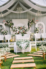 A wedding solemnization table adorned with exquisite floral decorations, radiating elegance and...