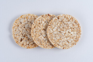 Pile of three rice cakes on white backdrop. Food background.