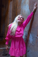 Happy mature woman in pink dress enjoying new beginning