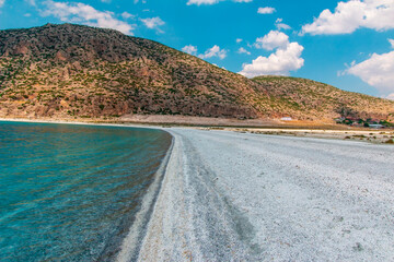 The unique view of the high mountains accompanied by the clear blue sea of Lake Salda on a sunny day. Burdur, Turkey.