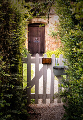 Cotswold Cottage Picket Gate In The Sleepy Village Of Great Tew, Oxfordshire