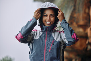 Woman, outdoor or portrait for hiking in rain with fashion, freedom and exercise for wellness....