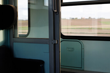 train compartment, seats in a train. outside the window landscape. compartment in a regional train. railroads