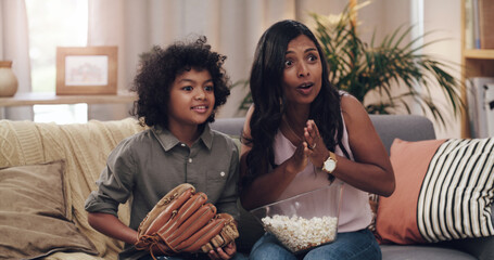 Child, mother and couch for watching baseball game with popcorn, glove and support for sports team....