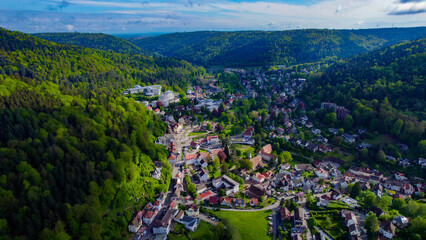 Aerial around the town of Bad Herrenalb in the black forest  on a sunny spring day