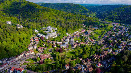 Aerial around the town of Bad Herrenalb in the black forest  on a sunny spring day