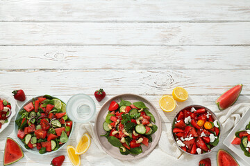 Watermelon and fresh fruit salad in a bowl on a white background