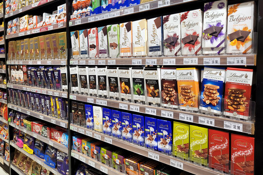 Kuala Lumpur, Malaysia - 16 FEB 2024: A variety of local and imported snacks, candies, and chocolates are showcased on the store shelves at Jaya Grocer.