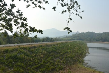 landscape of Klong bot water reservoir lake with mountain background in Thailand 