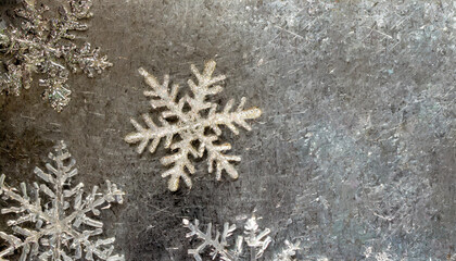 on a metallic rough background lie snowflakes winter time texture and snow