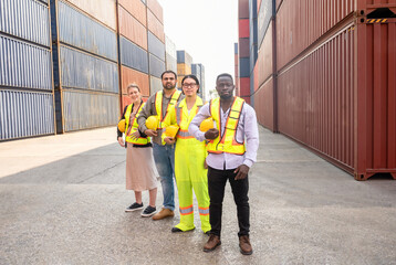 portrait group of engineers or cargo container workers holding hardhat,standing at container yard,concept of container shipping in export and import business and logistics