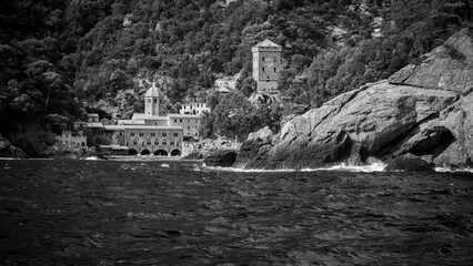 Magic of Liguria. Timeless images. Ancient abbey of San Fruttuoso, bay and historic building guarded by the FAI. Italian Environmental Fund. Black and white.
