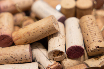 A pile of wine corks background. The corks are all different sizes and shapes
