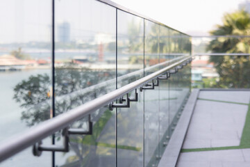 A railing with a view of a city and water