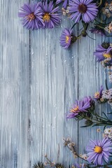 Rustic wooden background with a border of purple flowers
