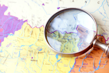 Magnifying glass on a map. Magnifying glass over a map. Travel Concept
