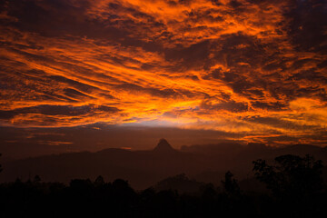 sunset over adams peak in sri lanka
