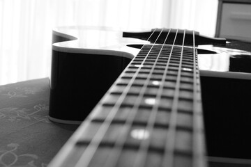 Black And White Close Up Photo Of A Guitar