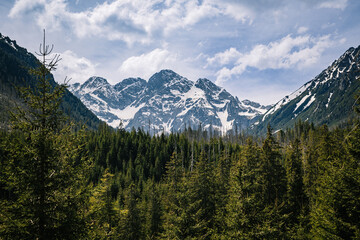 A mountain range with snow on top
