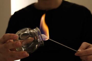physiotherapist burns cupping cup for cupping therapy