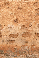 Detailed structure of an old weathered ochre-colored Mediterranean wall - 8814