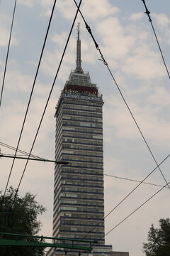 La Torre Latinoamericana/Latin American Tower, emblem of Mexico city surrounded by electric wires in a pattern, Mexico City