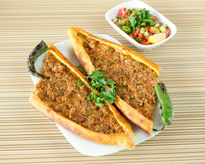 Turkish minced meat pie with salad