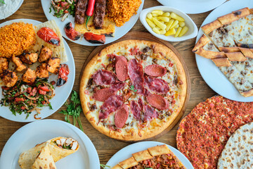 Top View photo: A collection of various dishes: grilled meat pizza