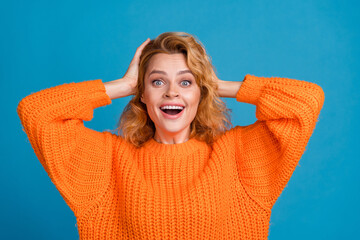Photo of adorable lovely woman wear stylish orange clothes jumper isolated on blue color background